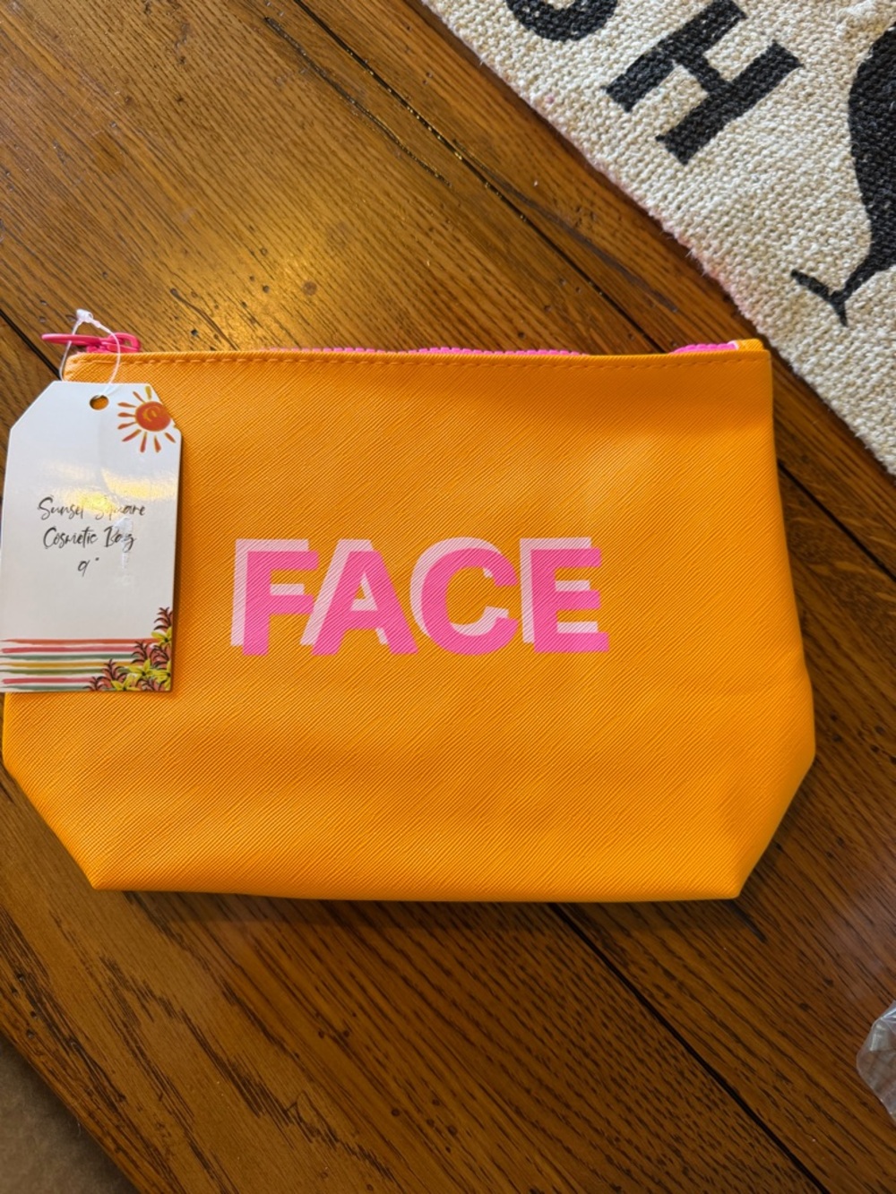 Orange 'FACE' Cosmetic Pouch with Pink Lettering